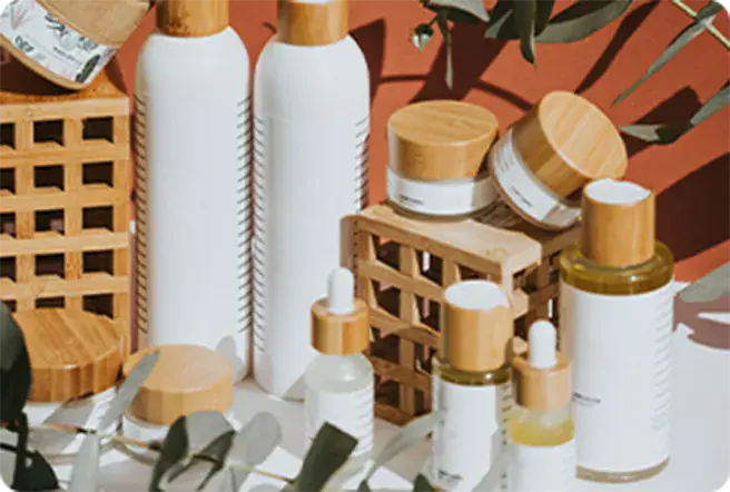 Unbranded cosmetic bottles, jars and droppers arranged as a product scene
