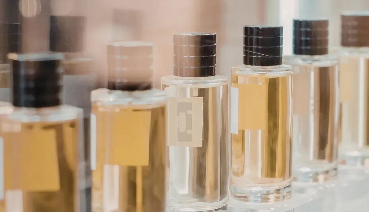 Unbranded cosmetic containers arranged as an illustrative product-packaging scene